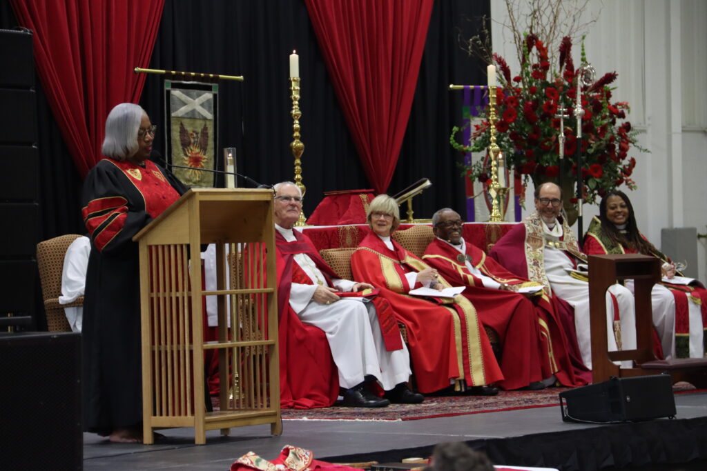 The Rev. Dr. Teresa L. Frye Brown, Bandy Professor of Preaching, Candler School of Theology, Emory University, brings smiles to the faces of a full complement of bishops with her quick wit during her sermon at the ordination service. Photos by Wil Oakes except where noted otherwise.